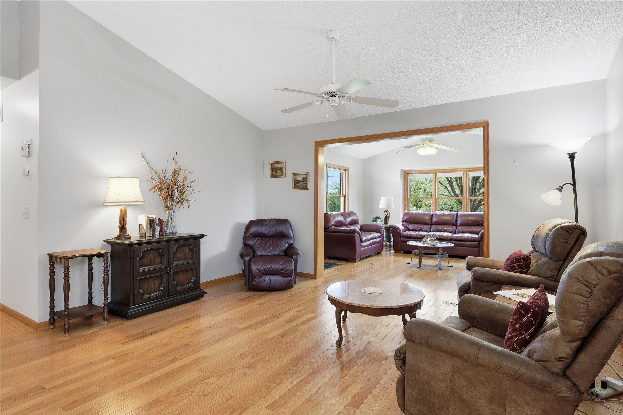 Designed for connection and comfort, the living room offers a spacious setting for gatherings, movie nights, or simply unwinding at the end of the day.