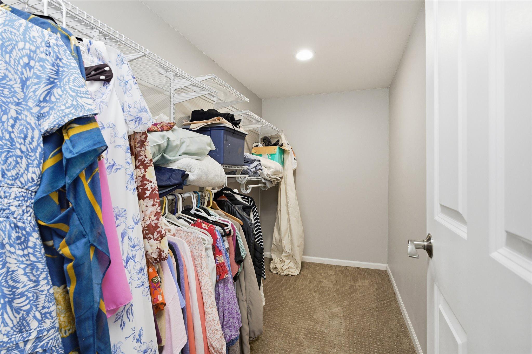 A walk-in closet provides generous storage and organization, adding convenience and functionality to the lower-level bedroom.