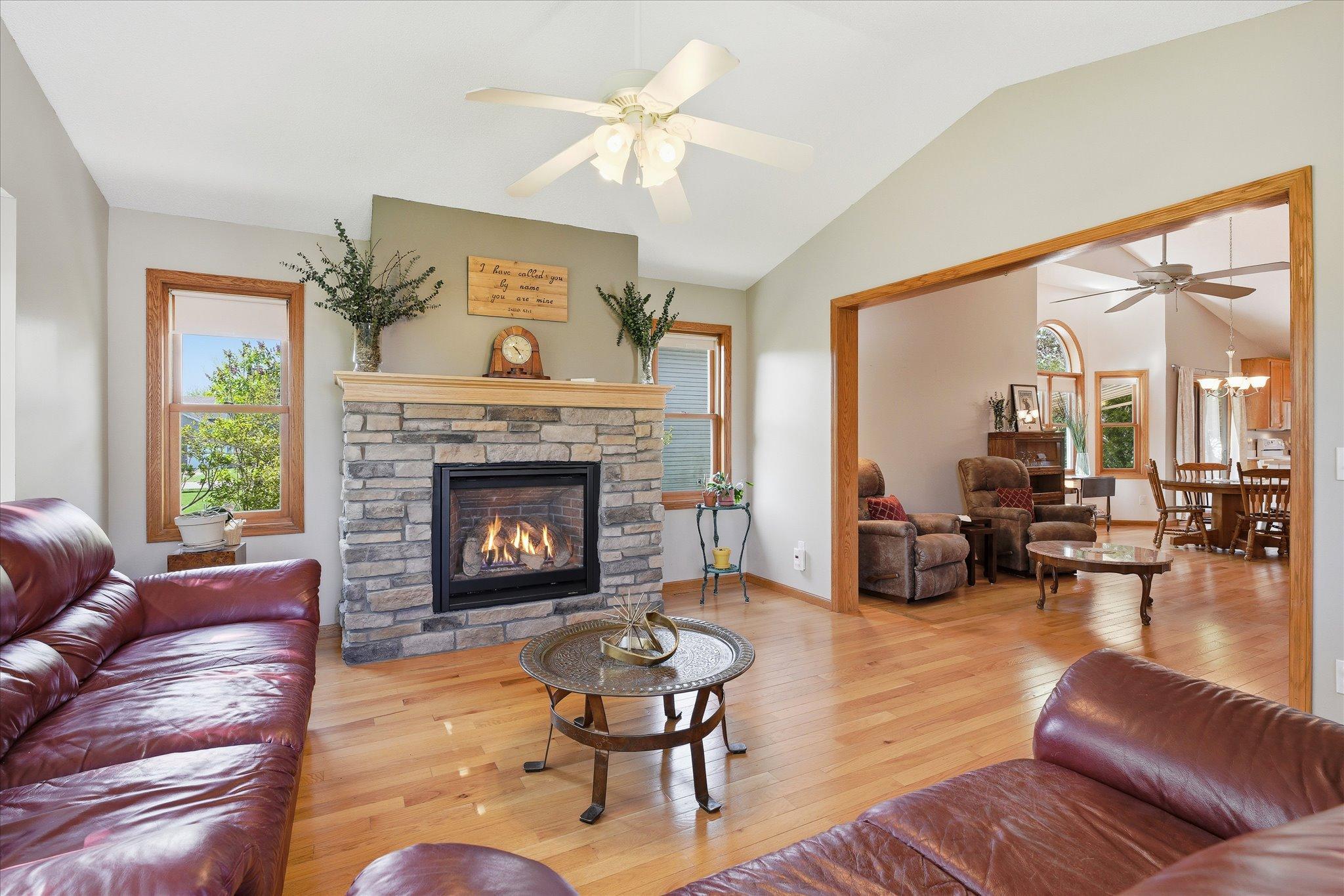 A cozy fireplace adds warmth and charm to the sunroom, creating the perfect place to relax during every season.