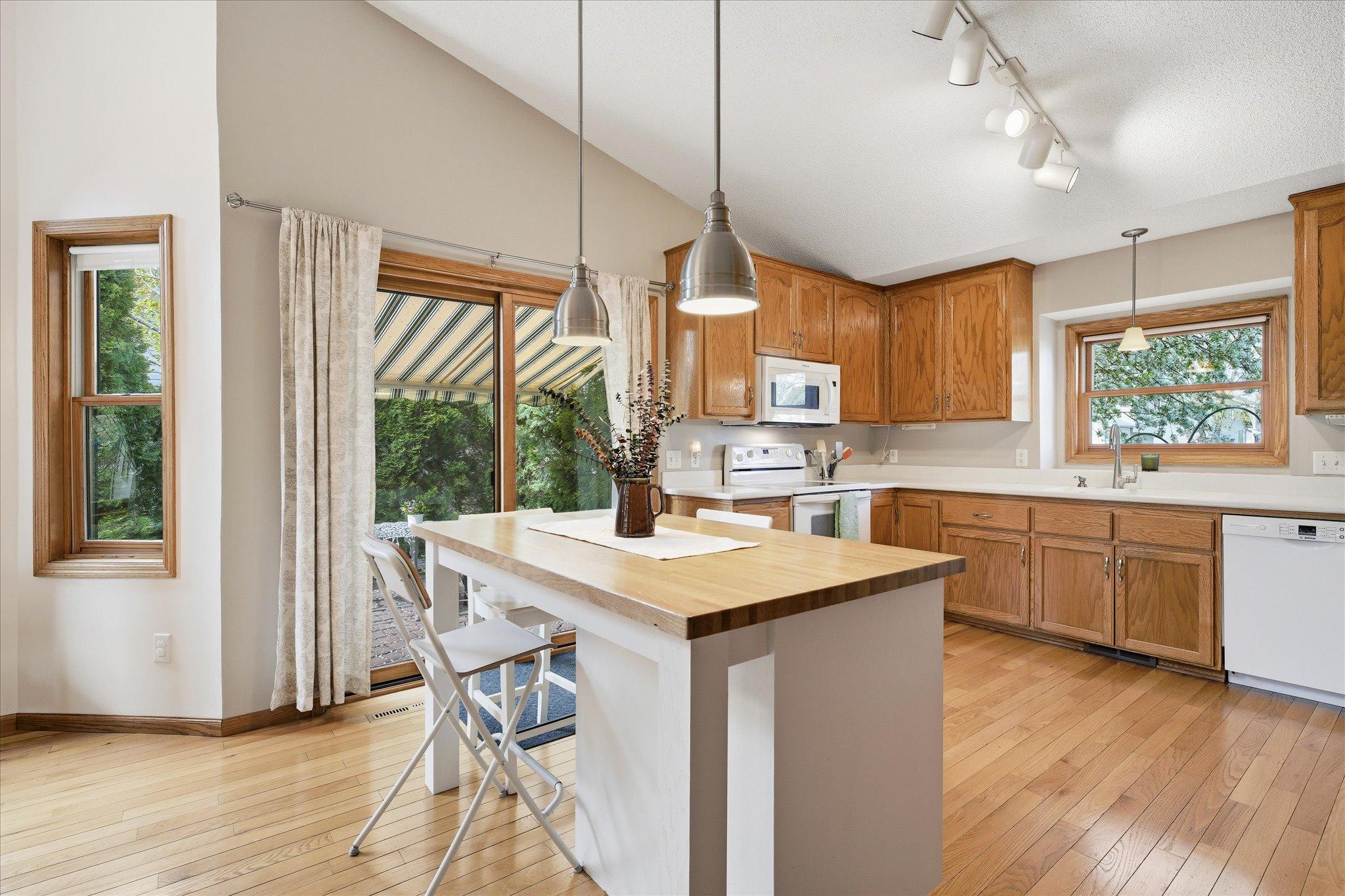 The kitchen offers a clean and inviting design with a layout that feels both functional and welcoming.