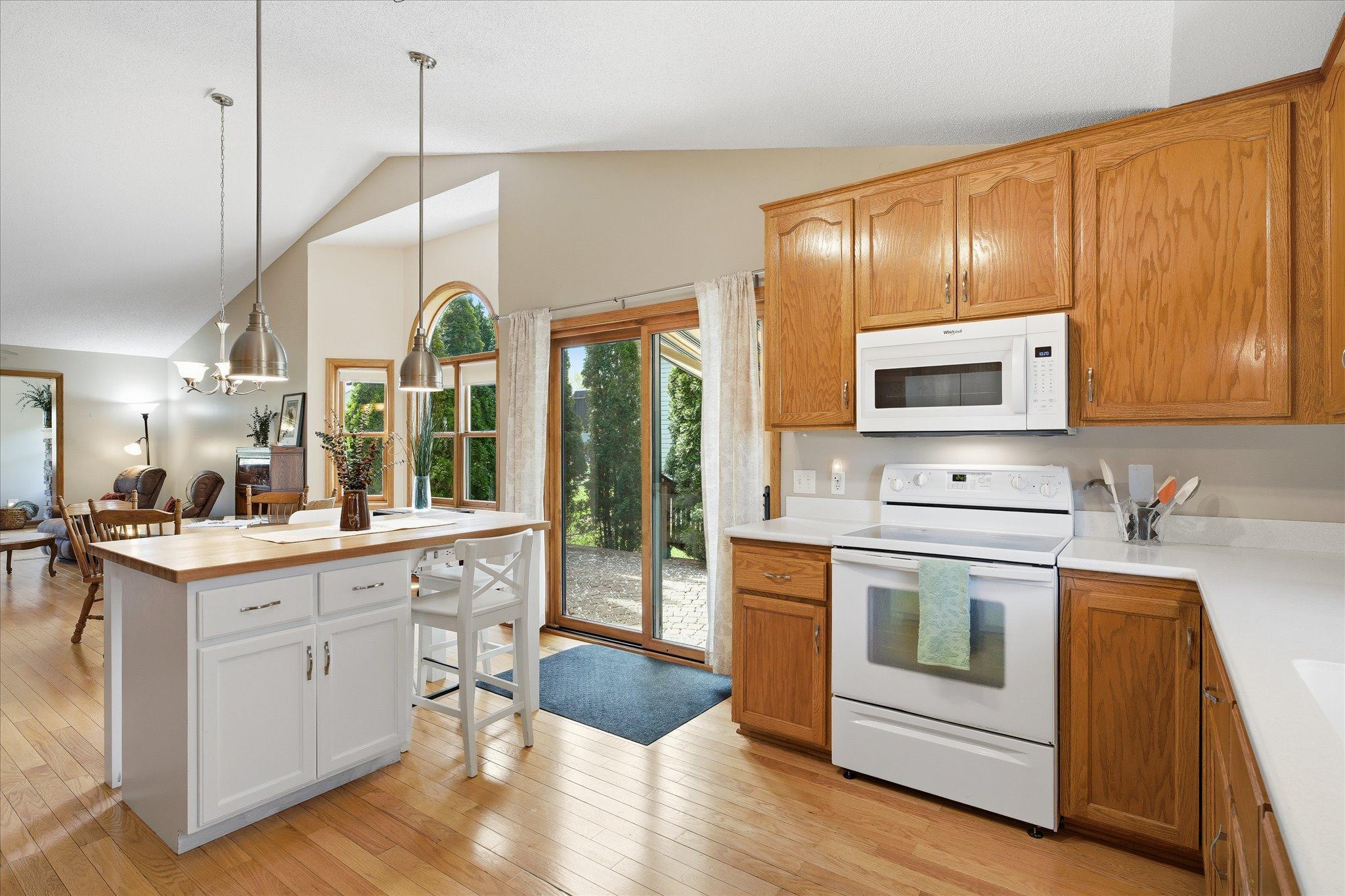 Step directly from the kitchen onto the private paver patio, creating a seamless indoor-outdoor connection. It’s perfect for entertaining or relaxing outside.