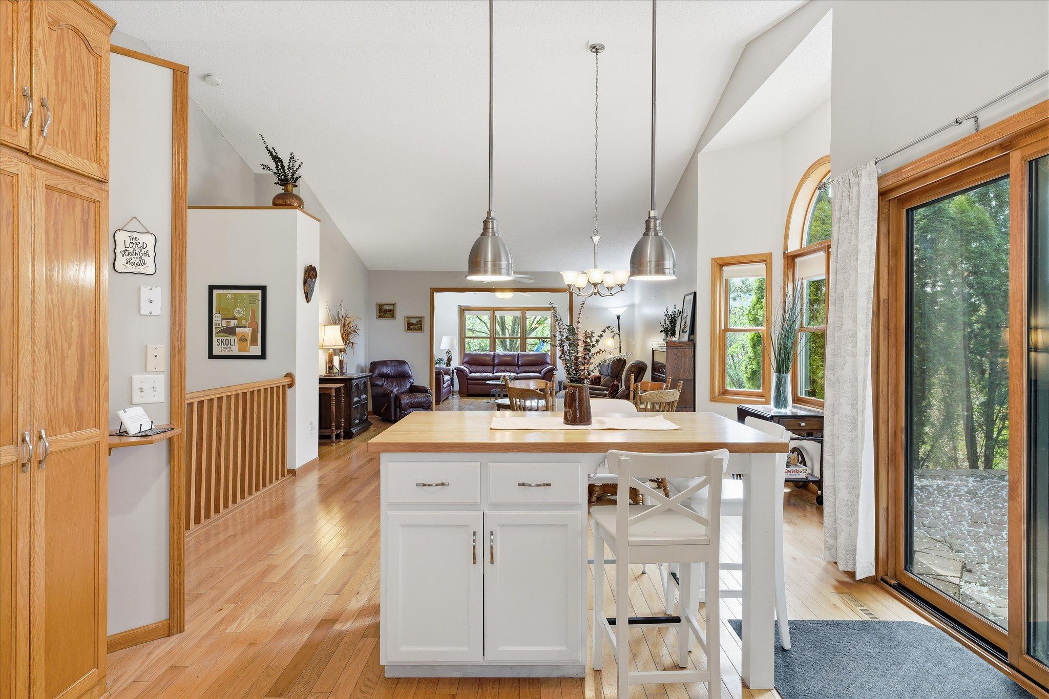 From the kitchen, enjoy views of the bright and open main level where natural light and thoughtful design create a connected living experience.