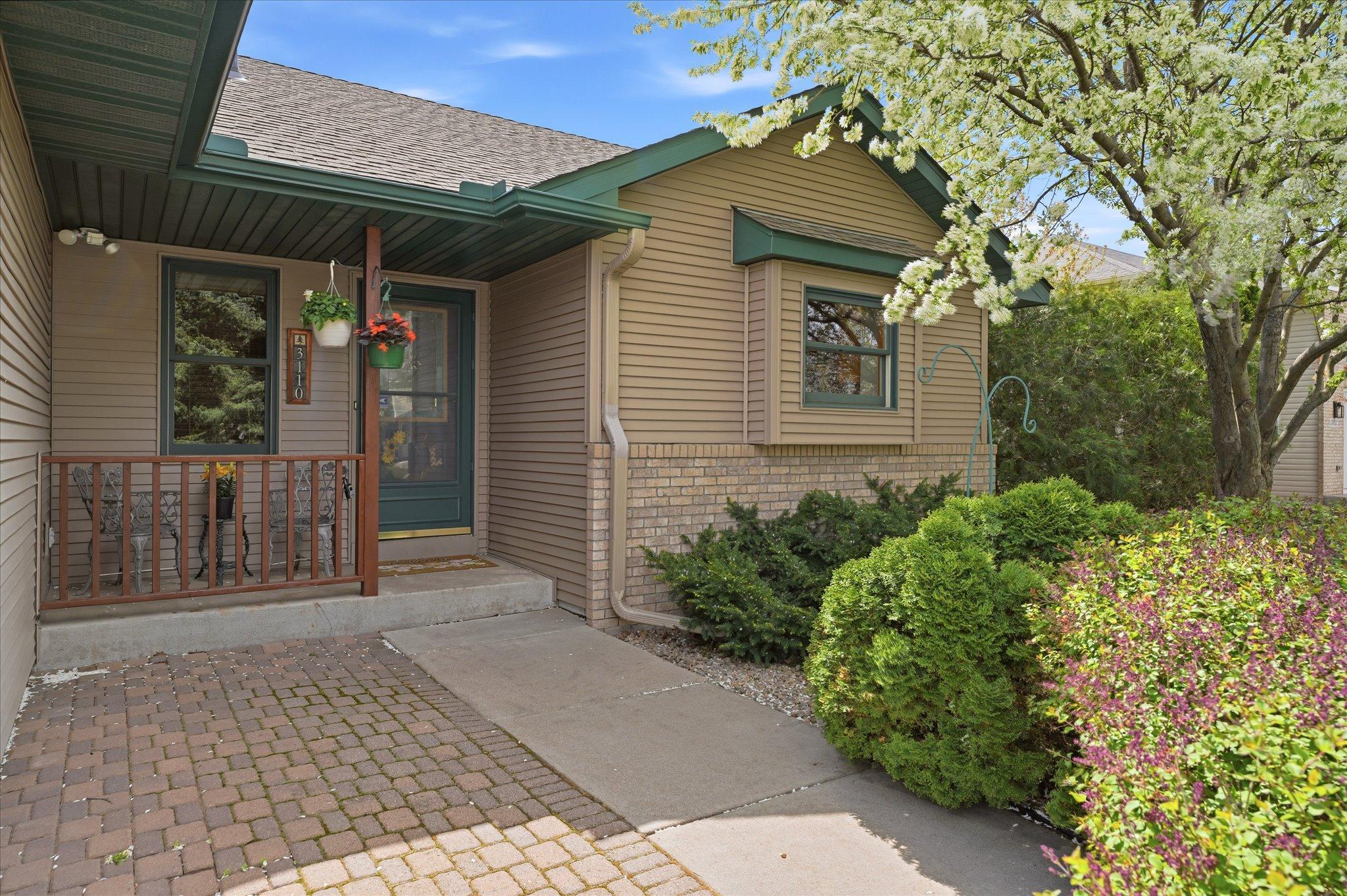 The welcoming front entrance sets the tone for the bright and open interior waiting inside.