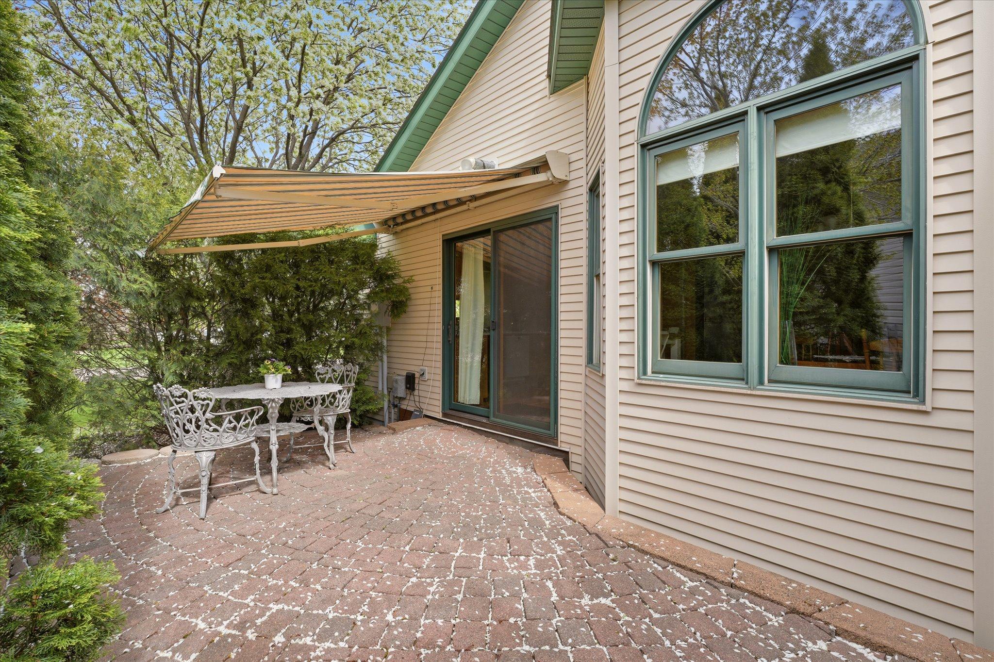 Located just outside the kitchen, the private paver patio creates an ideal extension of the living space for outdoor dining and entertaining.