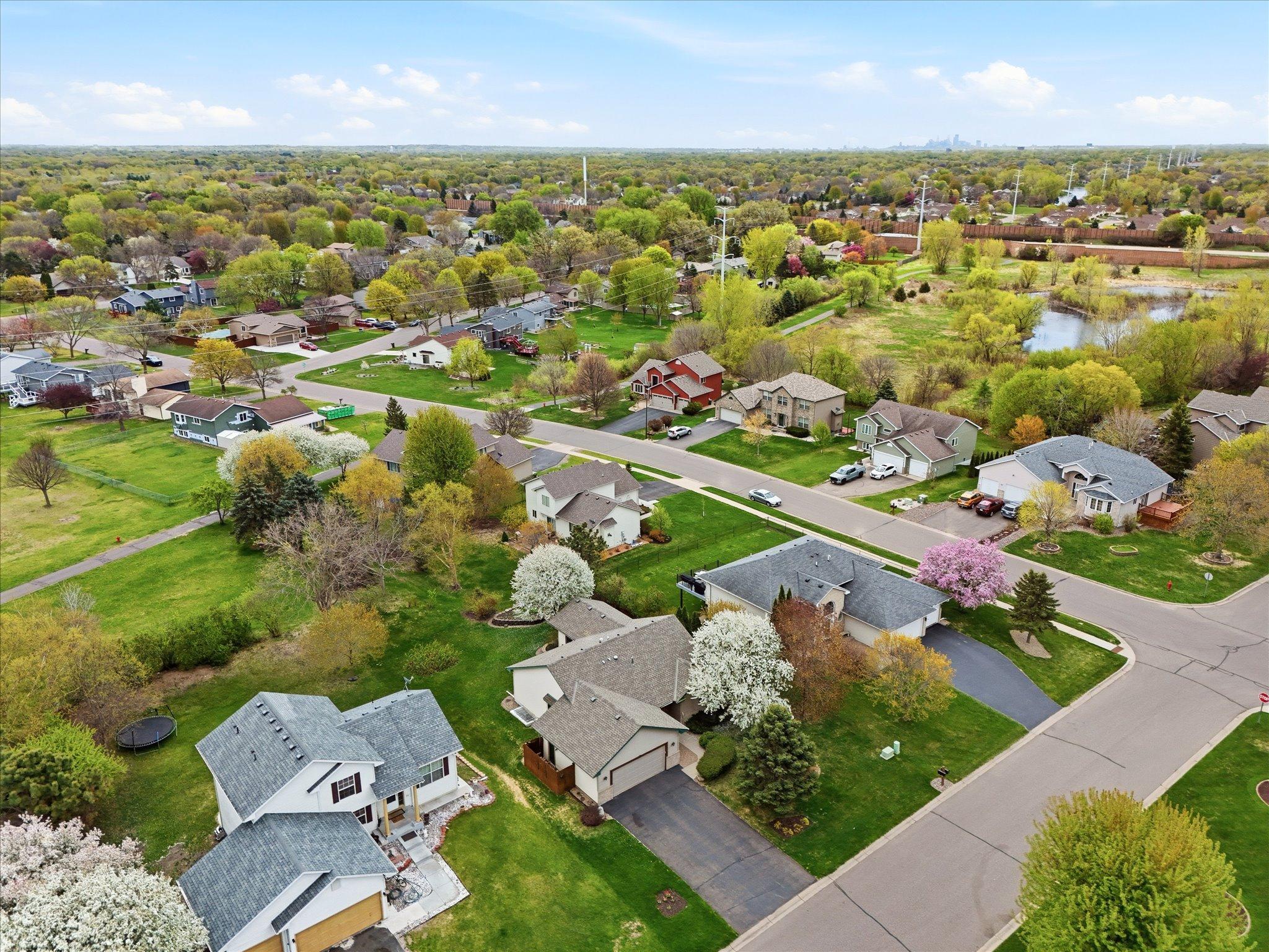 This aerial view showcases the home’s peaceful neighborhood setting and convenient access to parks, trails, and nearby amenities.