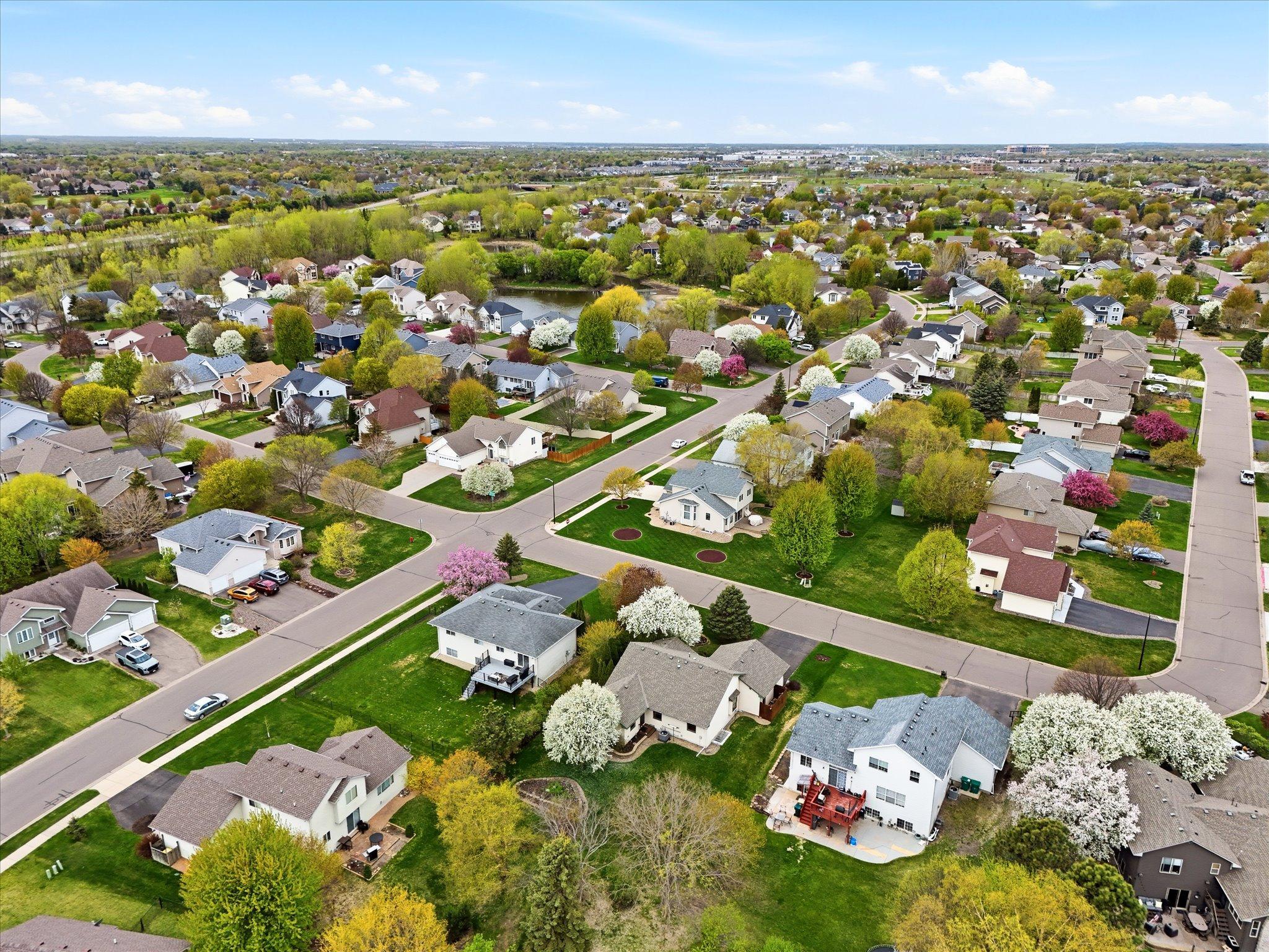 Another aerial angle highlights the home’s desirable location near parks, trails, and community amenities throughout the area.