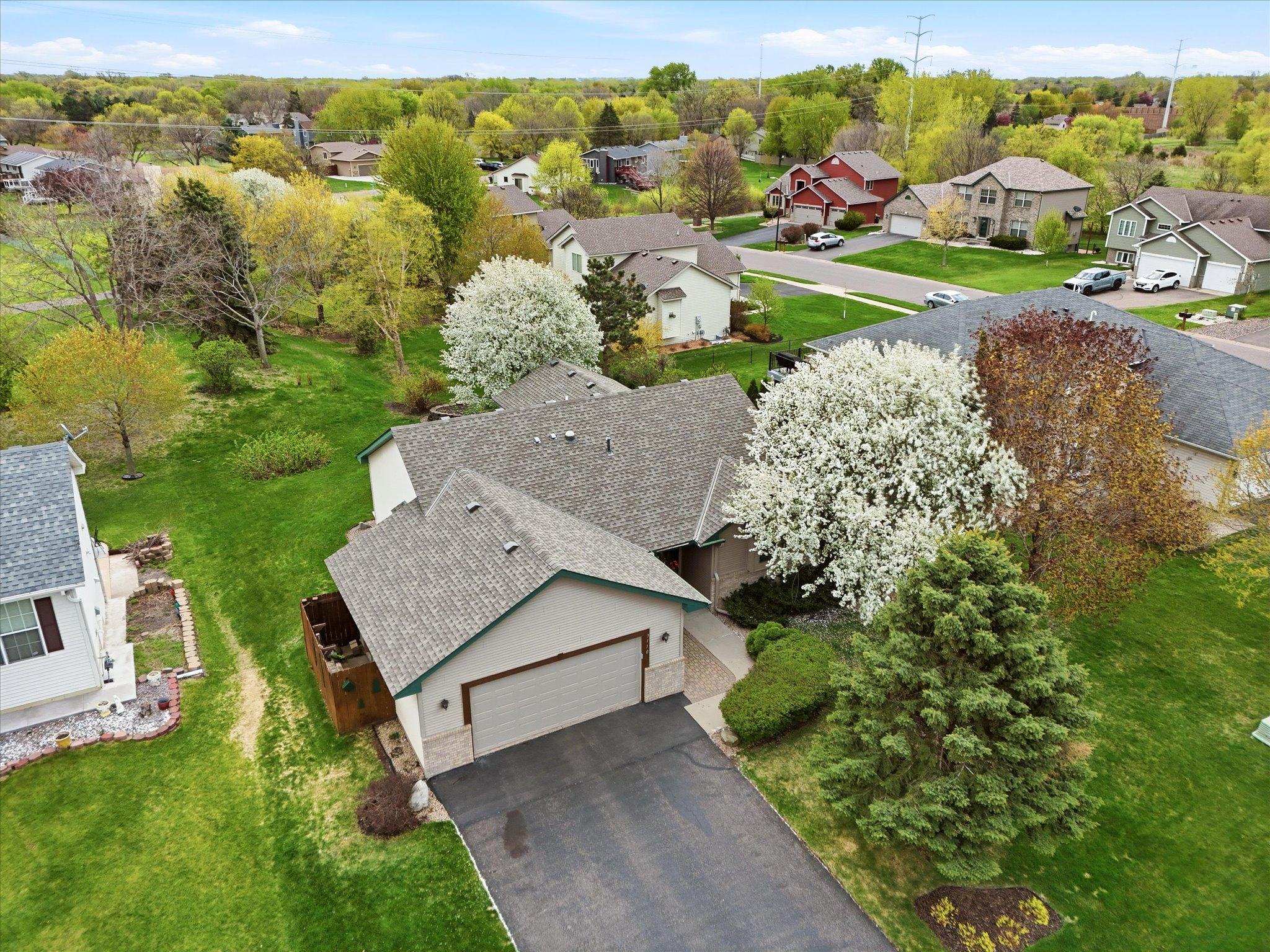 From above, the backyard’s privacy, landscaping, and connection to surrounding green space are beautifully showcased.