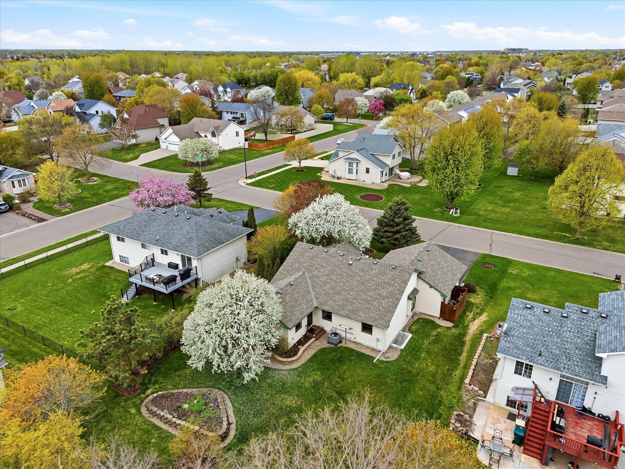 From above, the backyard’s privacy, landscaping, and connection to surrounding green space are beautifully showcased.