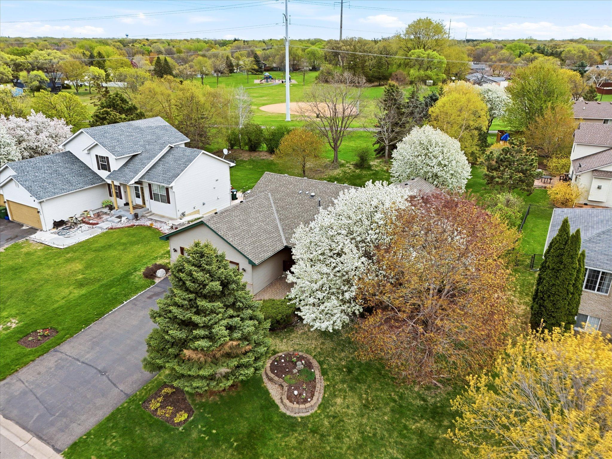 Royal Oaks Park directly behind the home creates a scenic backdrop while providing convenient access to outdoor recreation and trails.