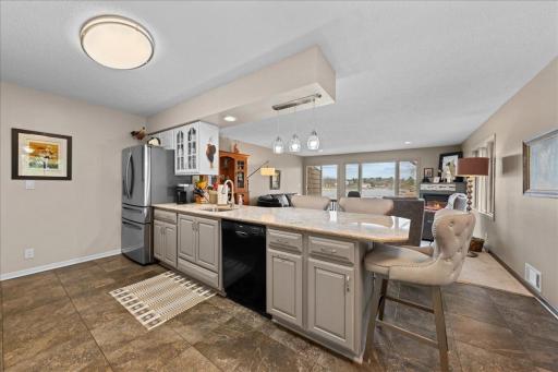 Solid surface counter top; a nice gathering space and separate dining area for a crowd
