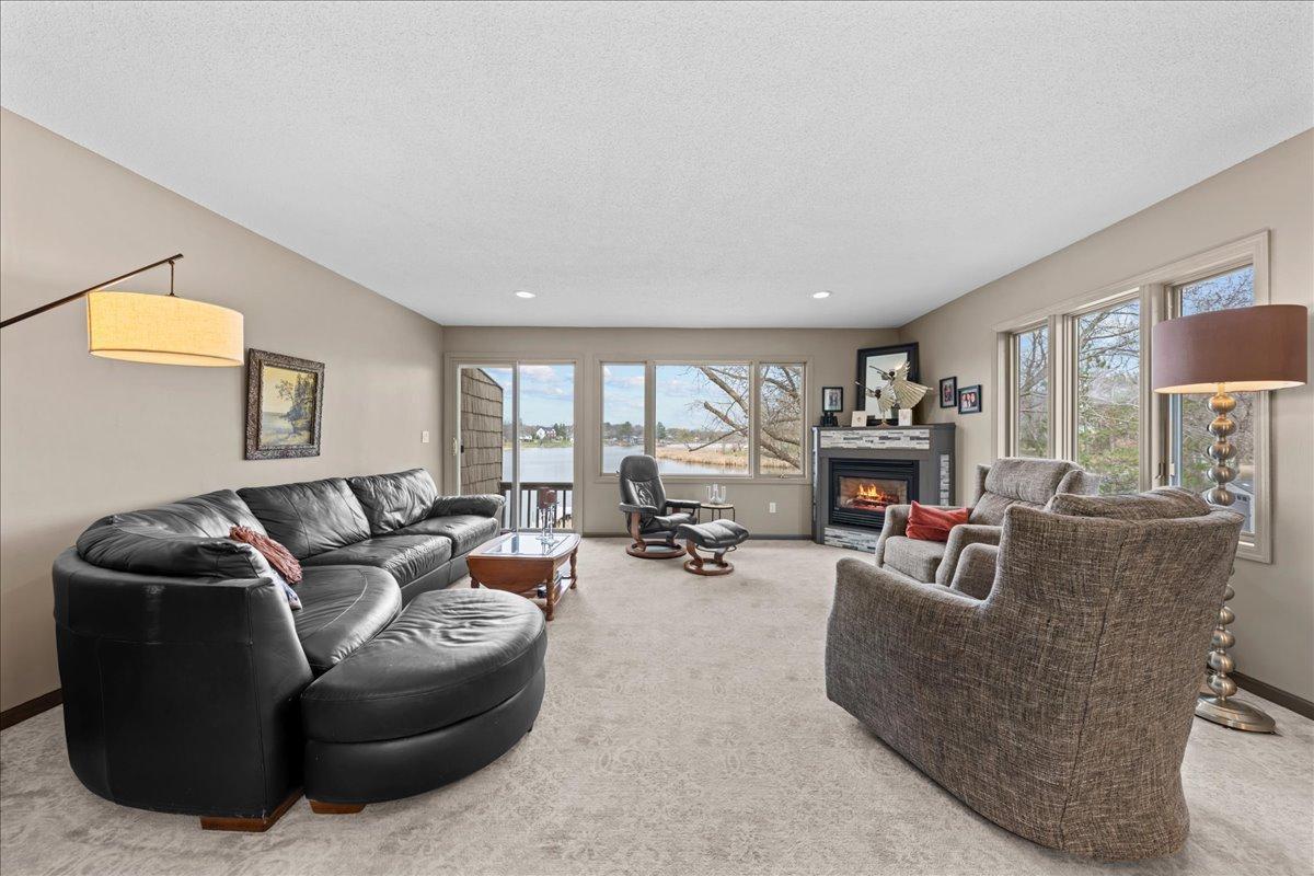 Another Patio Door to the second deck for more peaceful lakeside views. Gas Fireplace