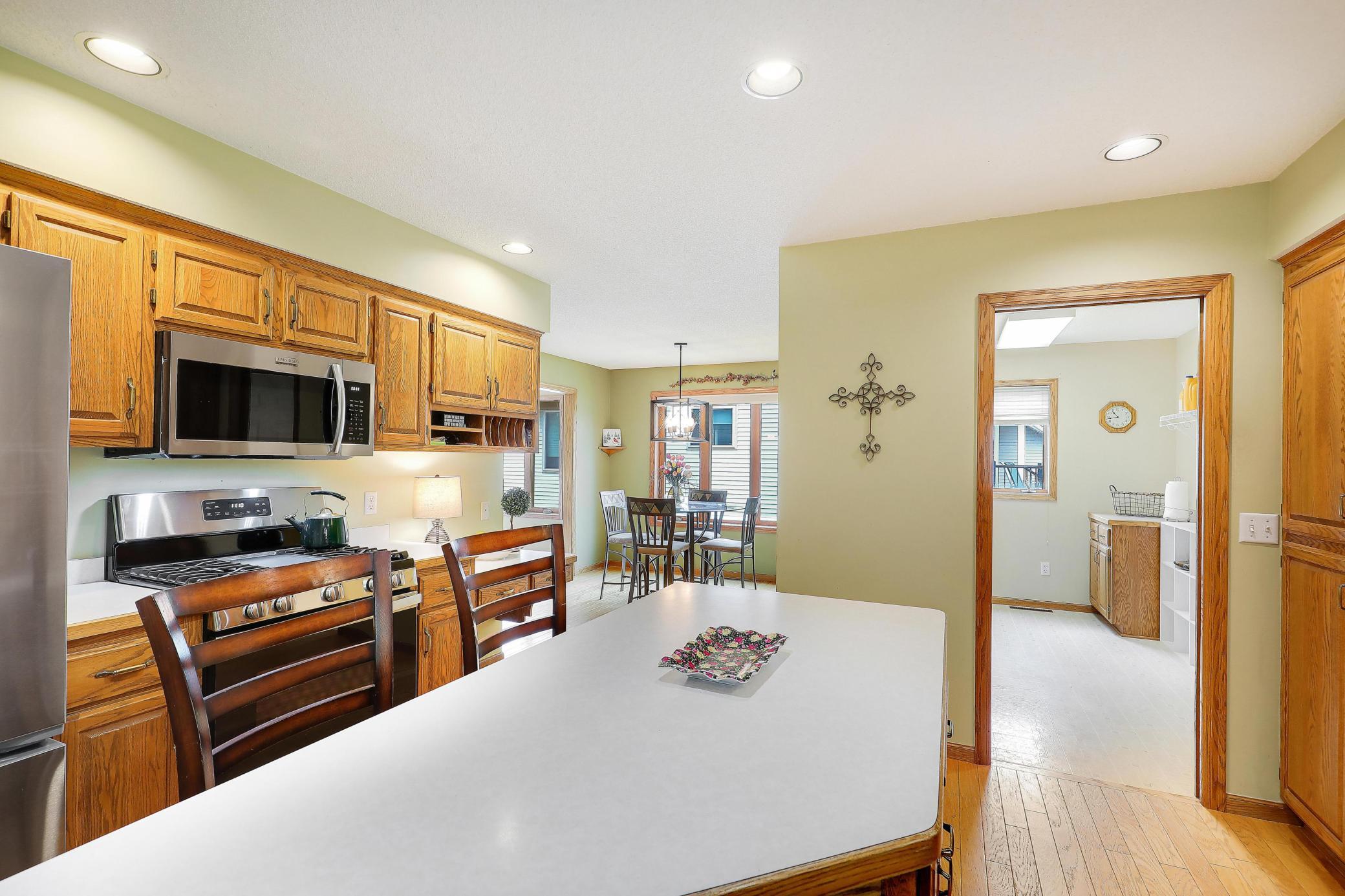 Kitchen convenient to informal dining room and laundry room.