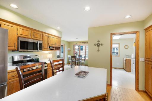 Kitchen convenient to informal dining room and laundry room.