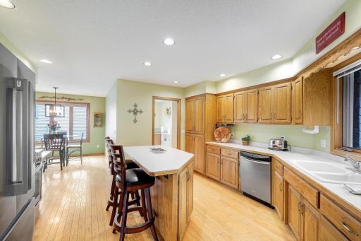 Kitchen has a huge kitchen center island, hardwood floors and more!