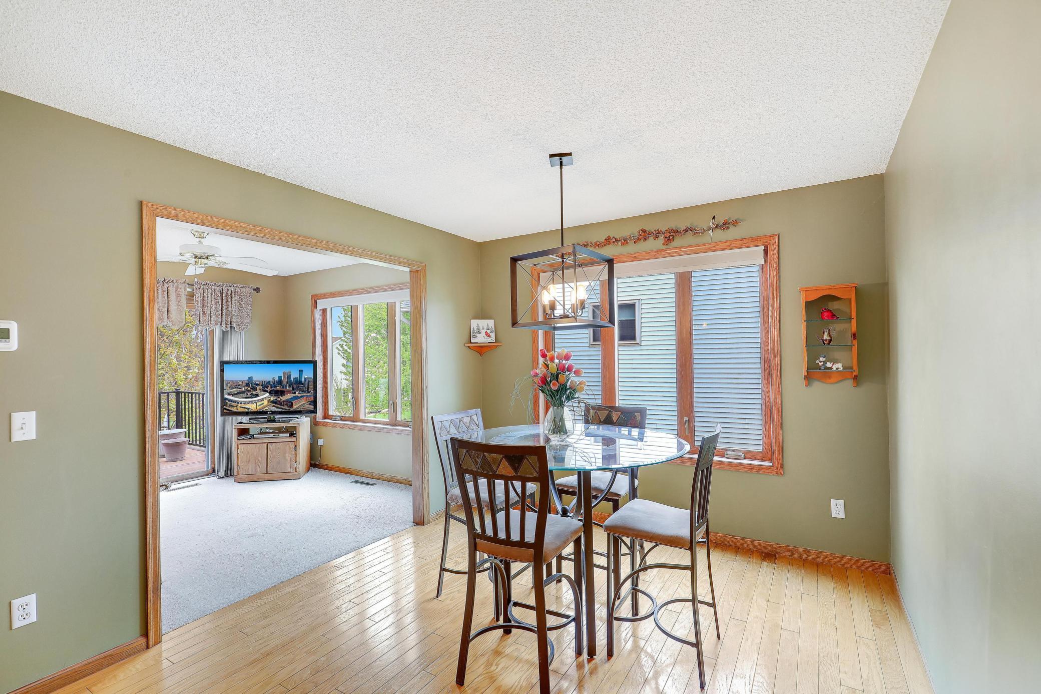 Informal dining room leading into a bonus sun room.
