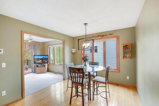 Informal dining room leading into a bonus sun room.