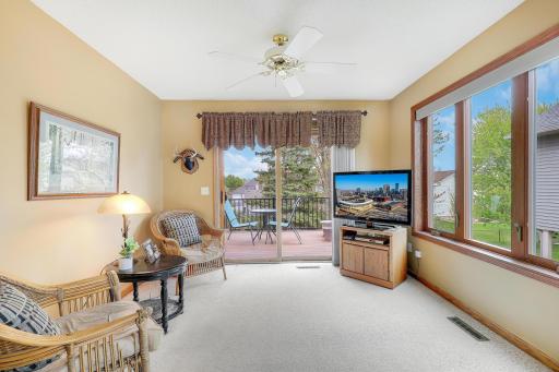 Bright and cozy sun room leading out to maintenance free deck.