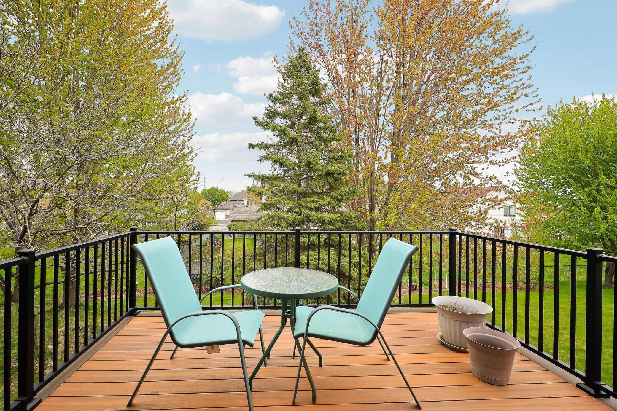 Another view of deck overlooking beautiful backyard.