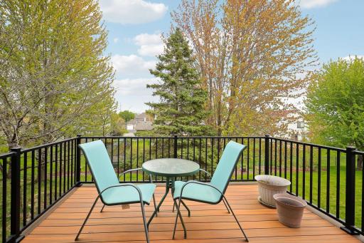 Another view of deck overlooking beautiful backyard.