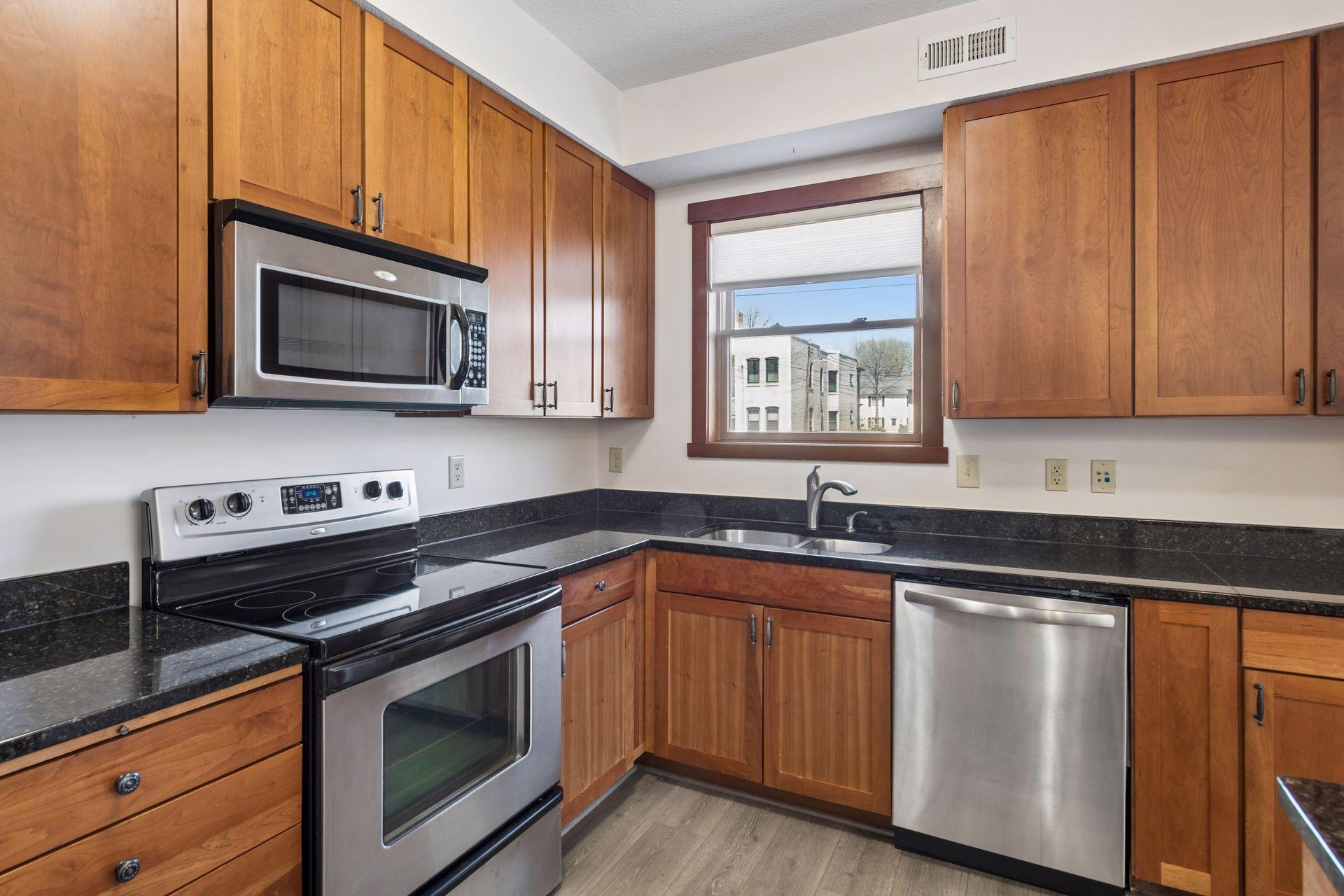 Stainless electric stove, microwave and dishwasher.