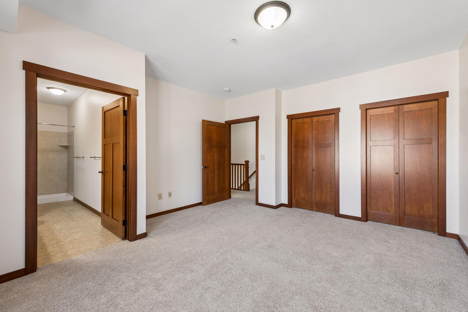 Primary ensuite with full bath and large closet with double doors.