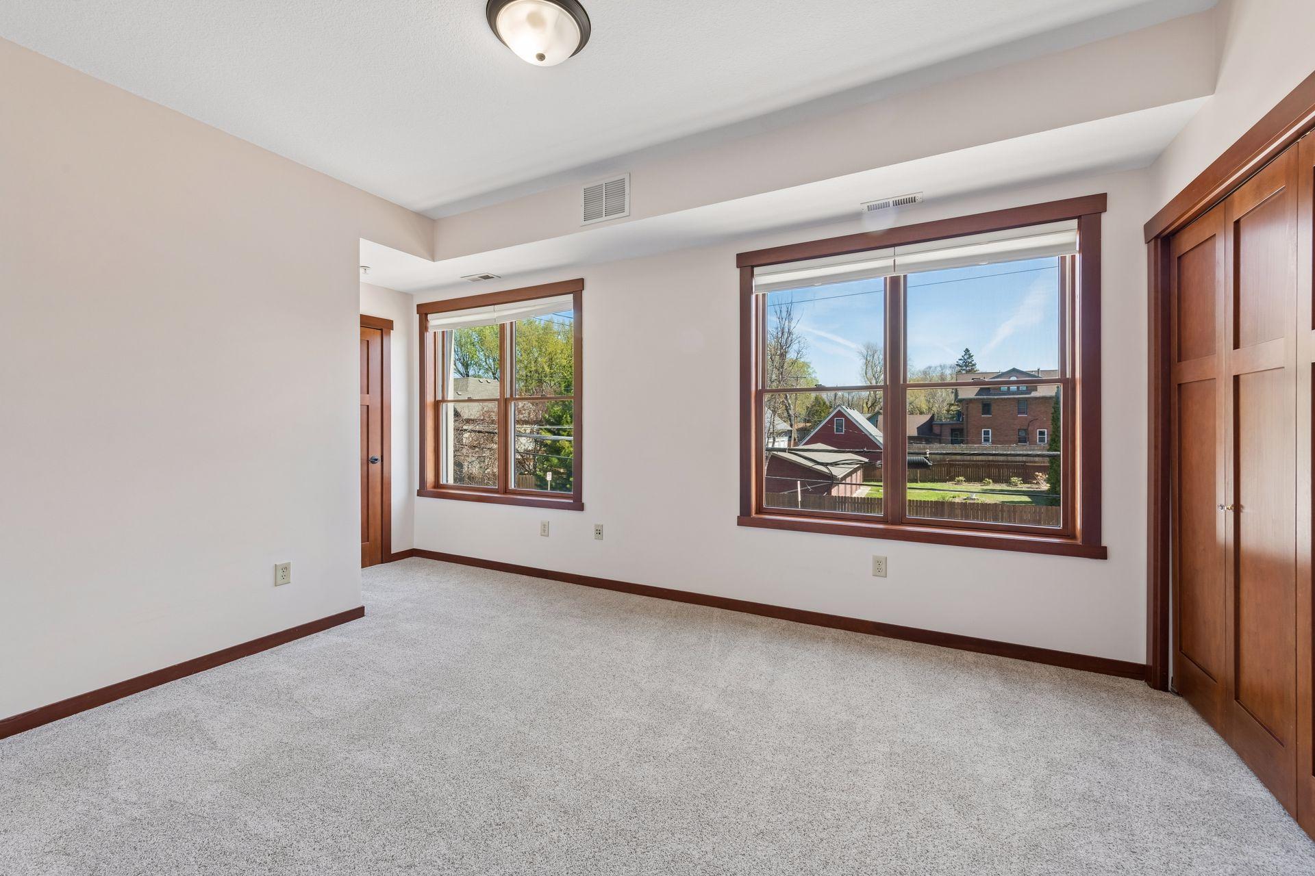 Second upper level bedroom with gorgeous windows.