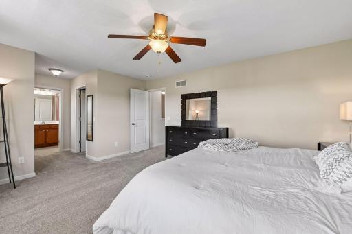 Large primary suite with views of backyard