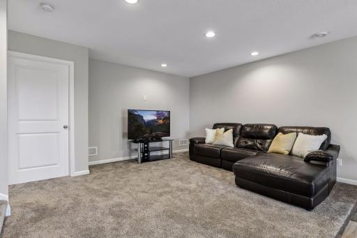 Spacious lower-level family room with recessed lighting