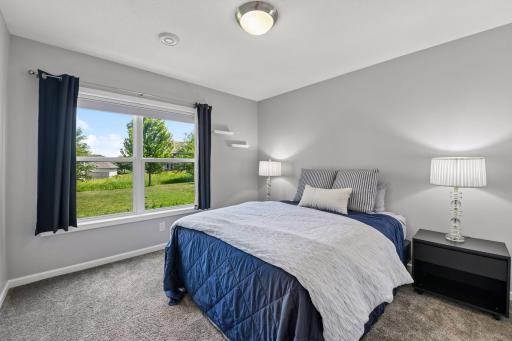 Lower level bedroom with fantastic backyard views