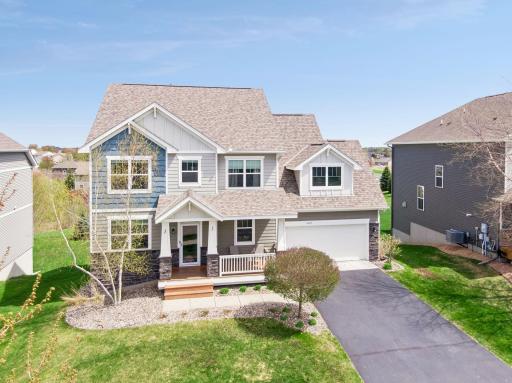 Covered front porch with beautiful curb appeal. 3 car tandem garage.