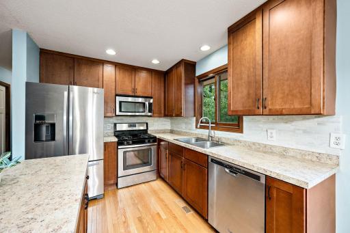 Stylish backsplash and a kitchen window for additional natural light!