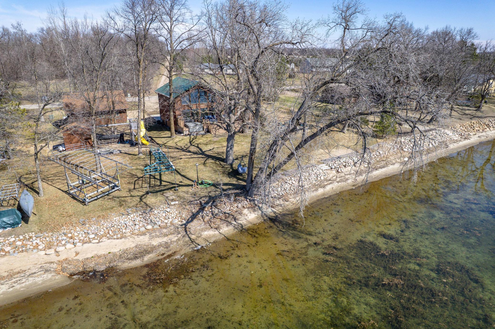 Swing on Tree Extends Over Water
