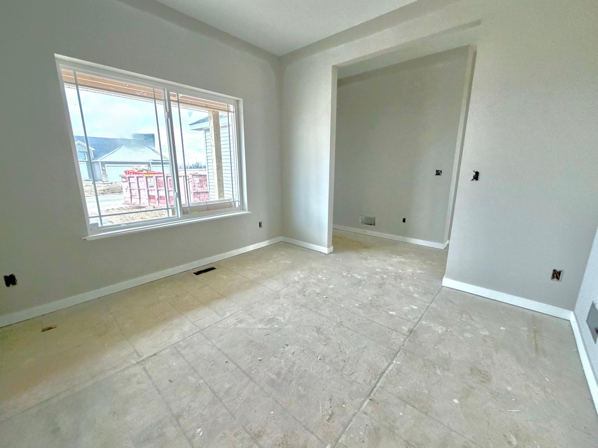 3199 Jandura Ave NE- Photo of actual home. Main floor flex room.