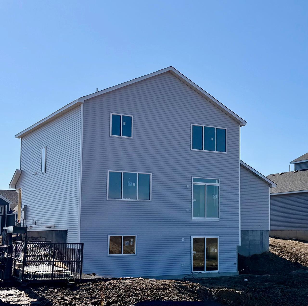 3199 Jandura Ave NE- Photo of actual home under construction. Rear elevation features a Walkout Lower Level to a spacious backyard located on a Corner Homesite!