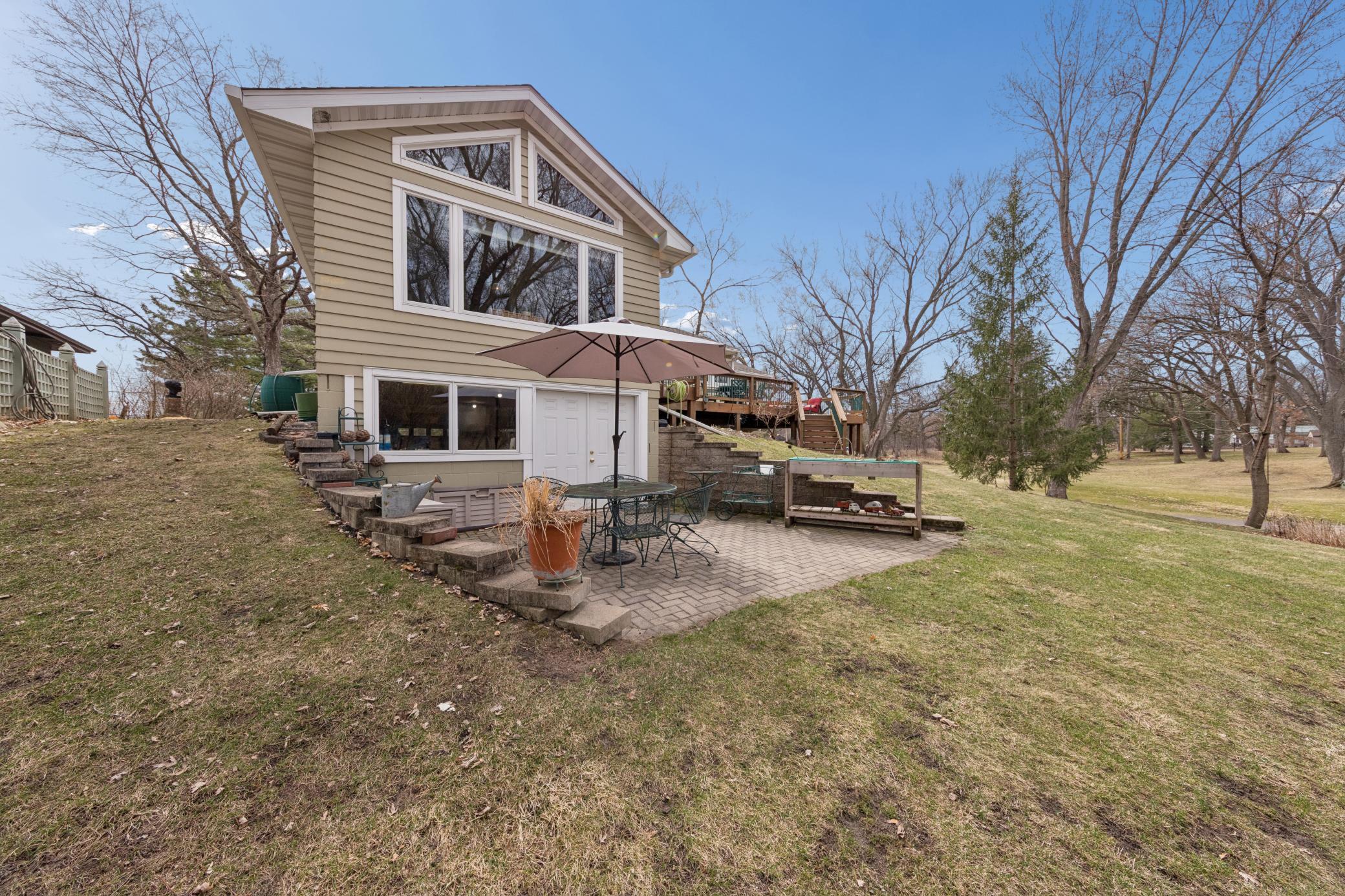 Lower level paver patio with access to the garage