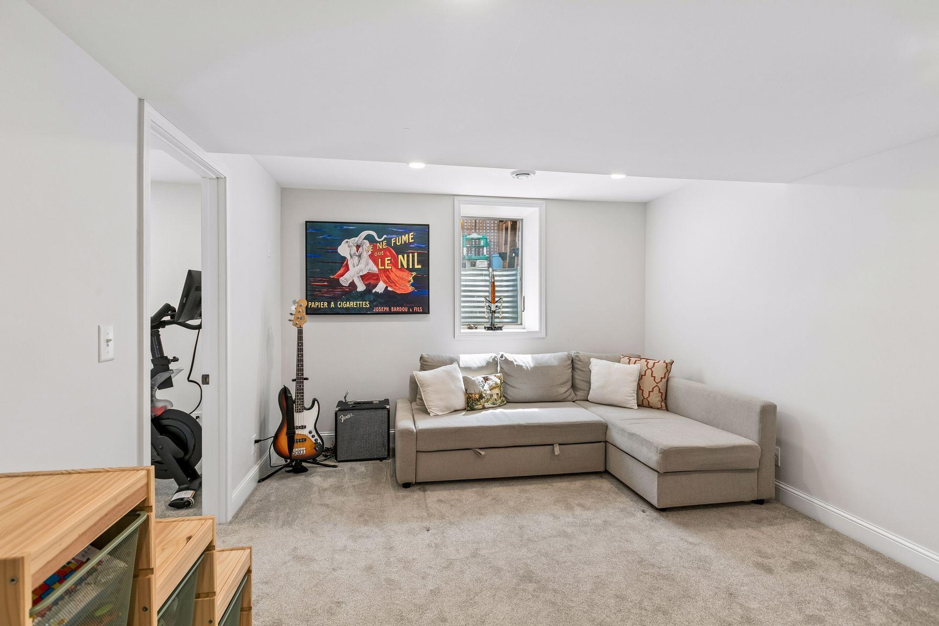 Lower level family room with egress window.