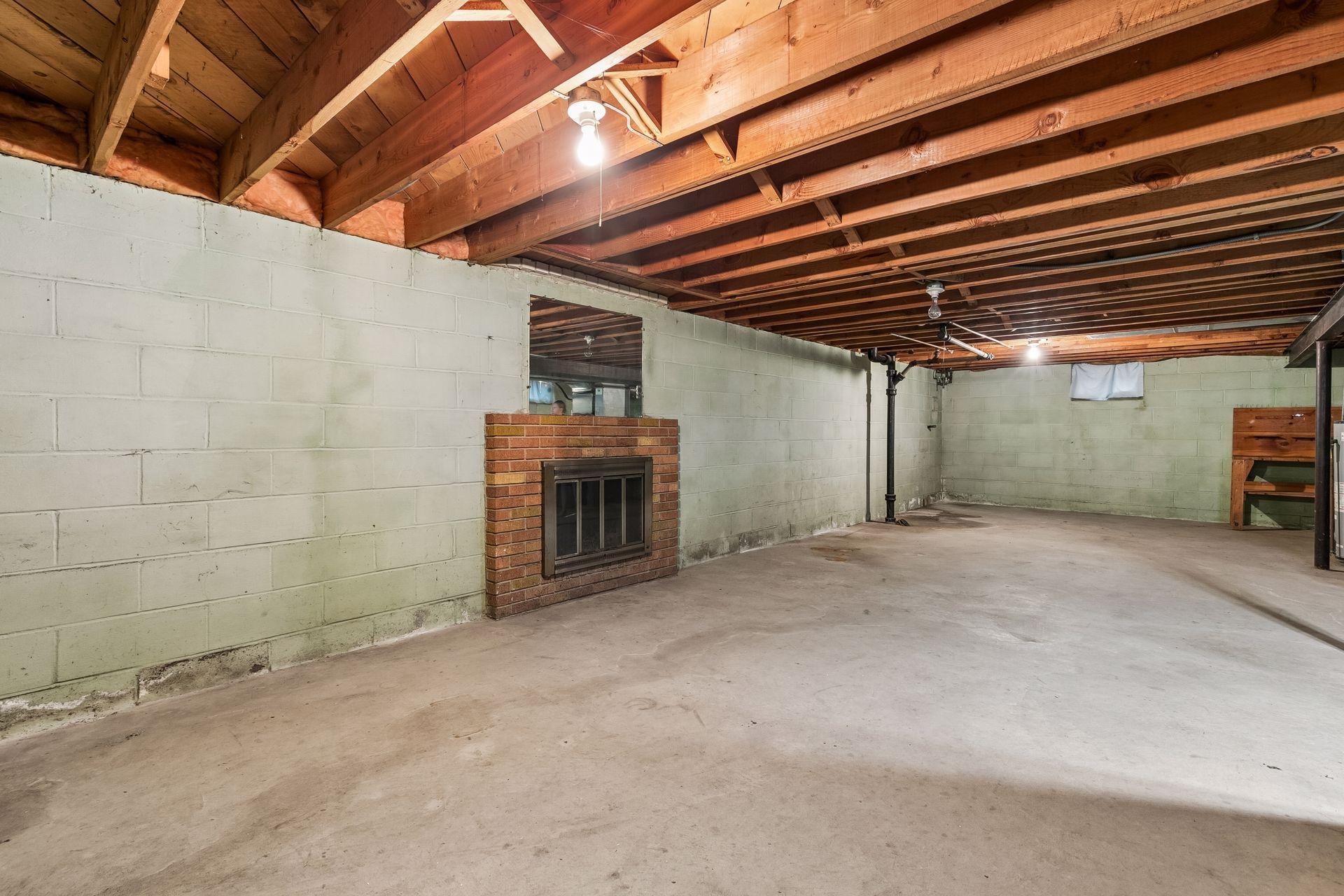 unfunished basement w/ fireplace! great potential!