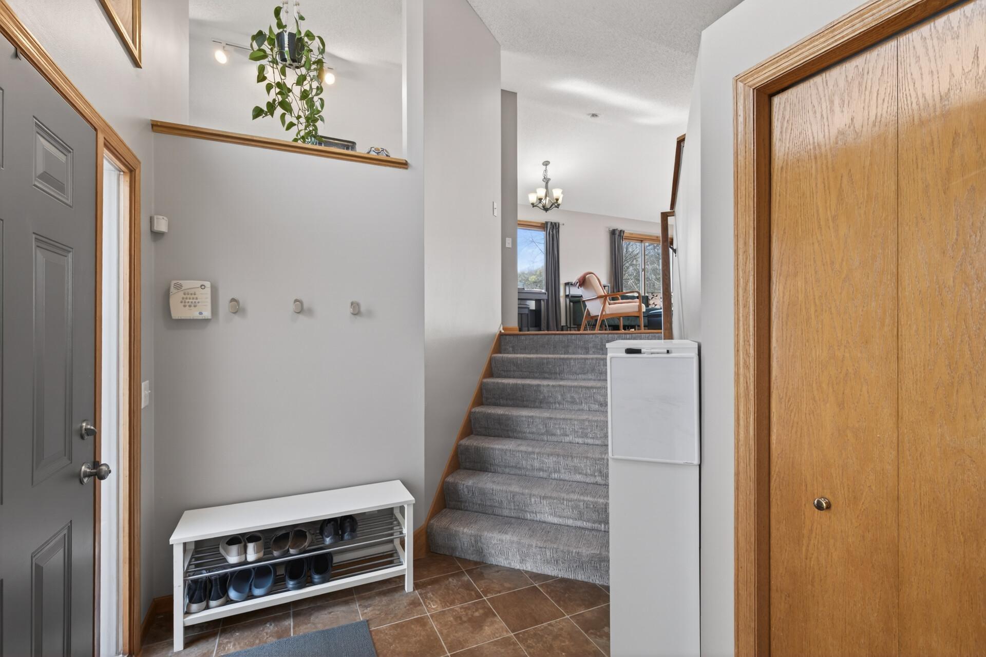 Spacious entry with coat closet and newer carpet