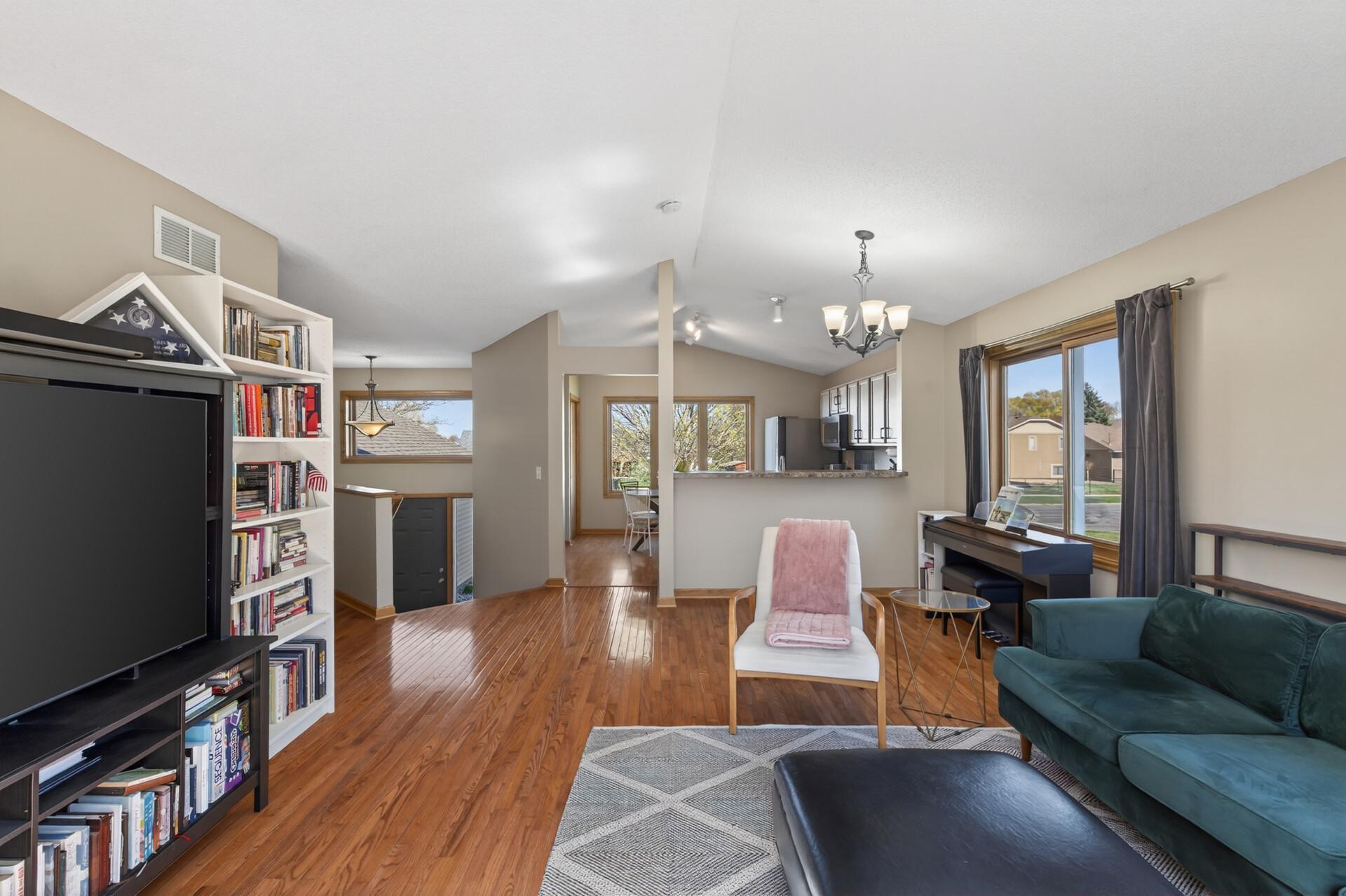 Openness and brightness throughout with vaulted ceilings, multiple windows