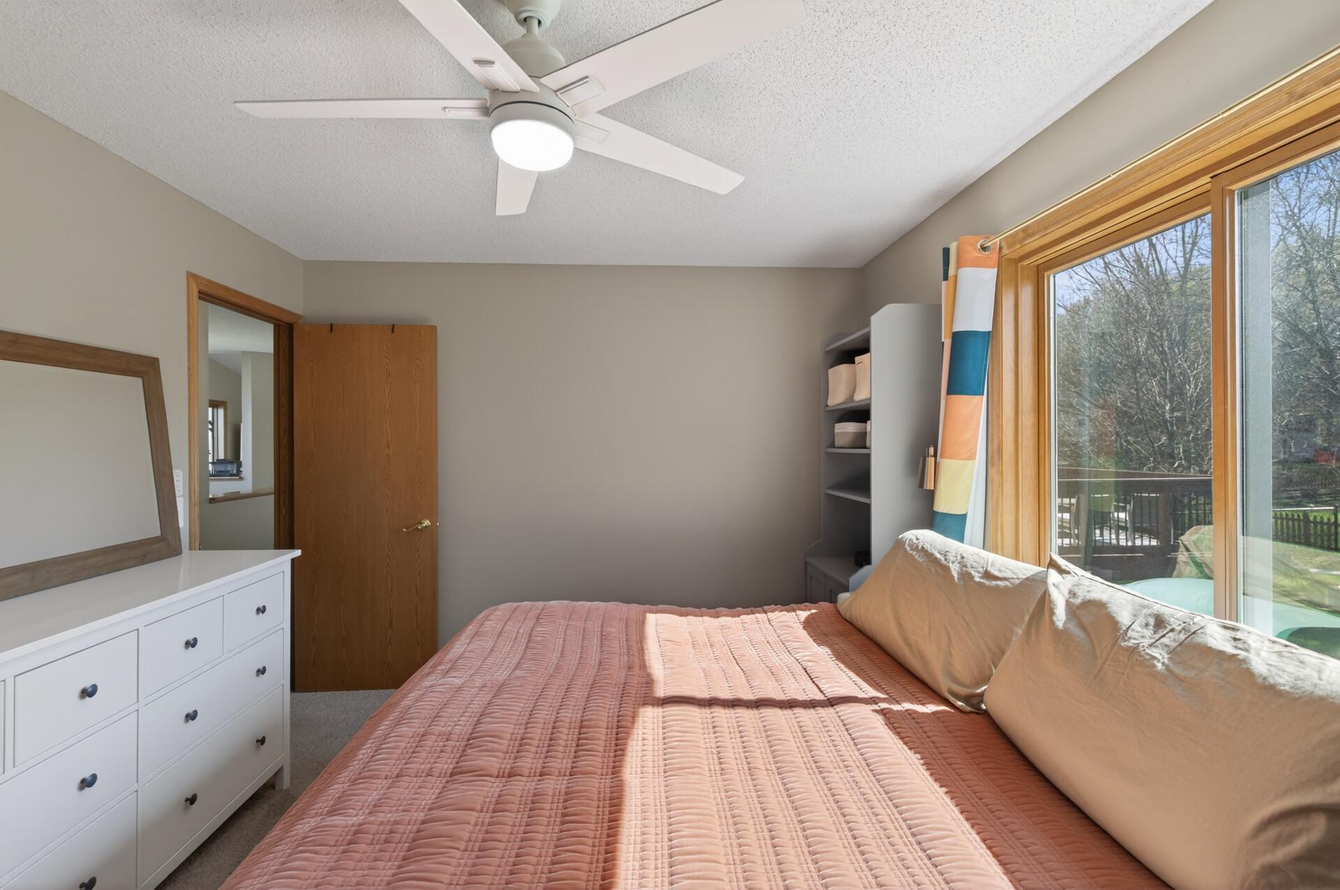 Owners suite offers ceiling fan and room for a larger bed