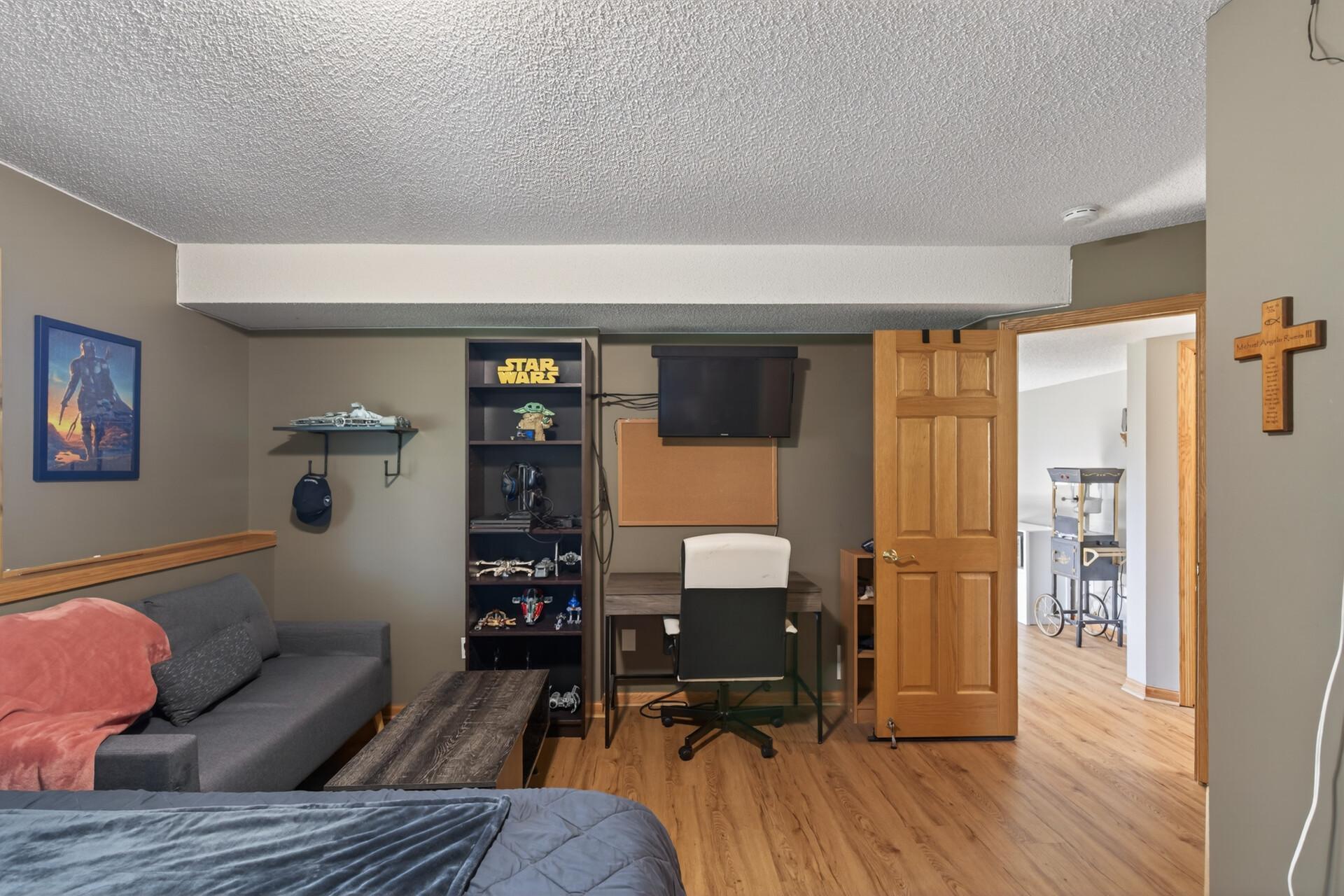 Newer floors in this bedroom plus paneled entrance door