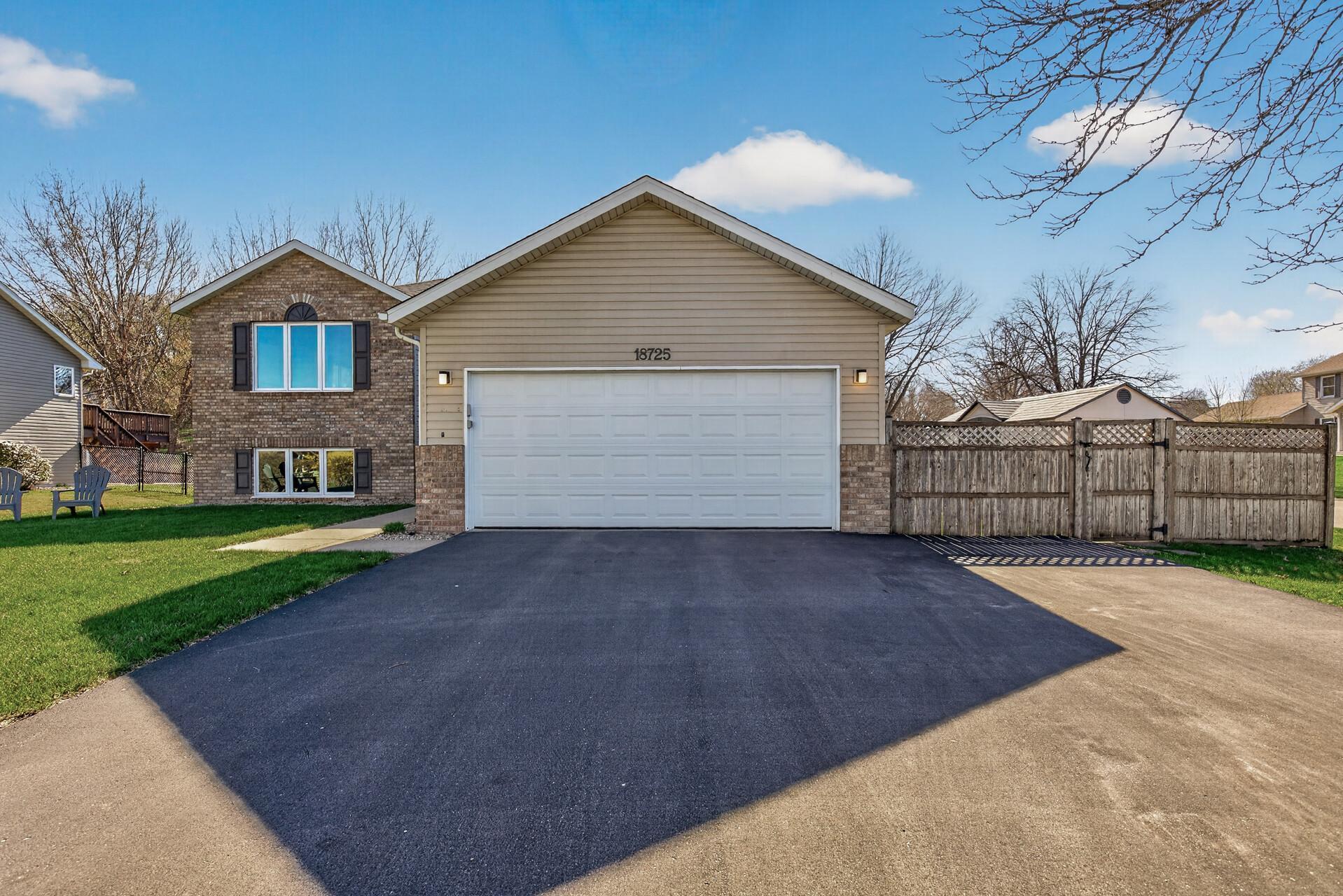 Newer oversized Asphalt driveway PLUS Fully-fenced backyard
