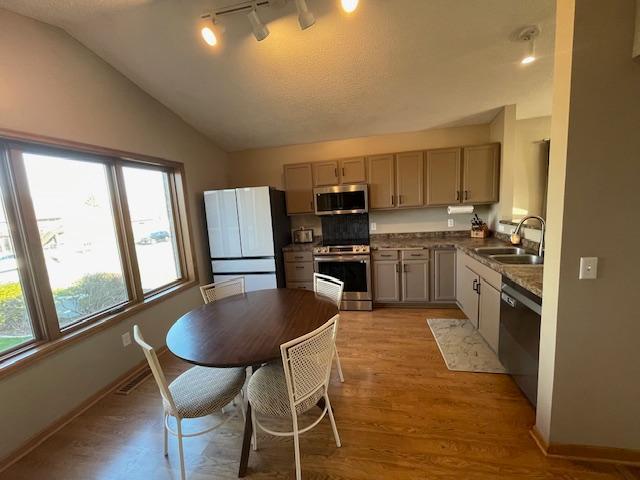 Updated kitchen offers enameled cabinetry