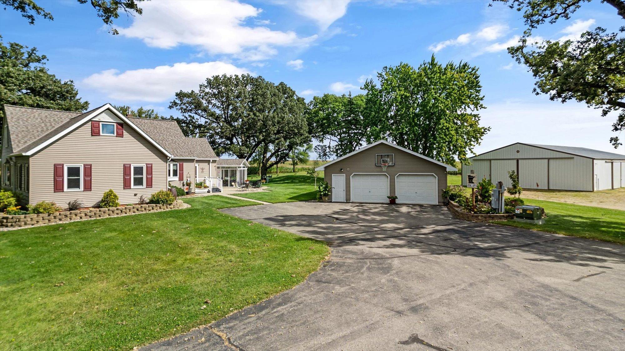 Home, 28x28 Detached Garage & 99x54 Pole Shed.