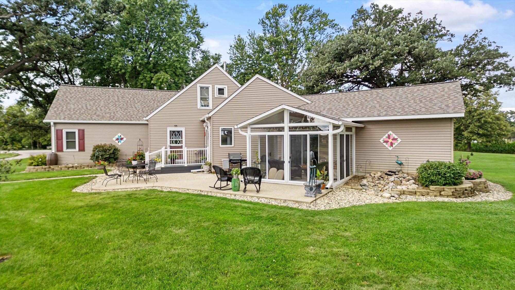 View of east side of home. Note the sunroom addition! Enjoy morning coffee and sunrises!
