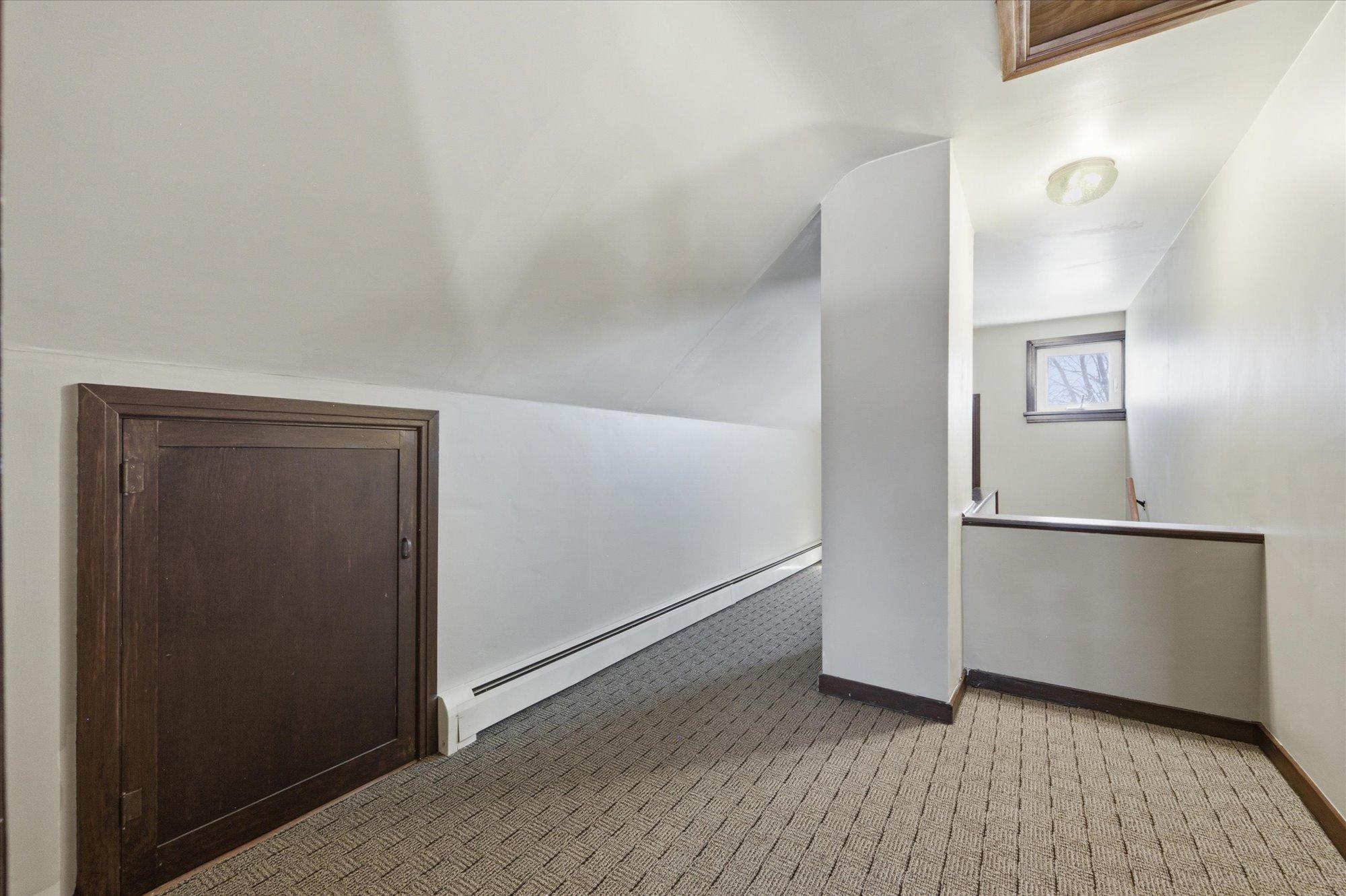 Landing and hall, second floor. There are two doors that lead to attics. Refer to floorplan rendering.