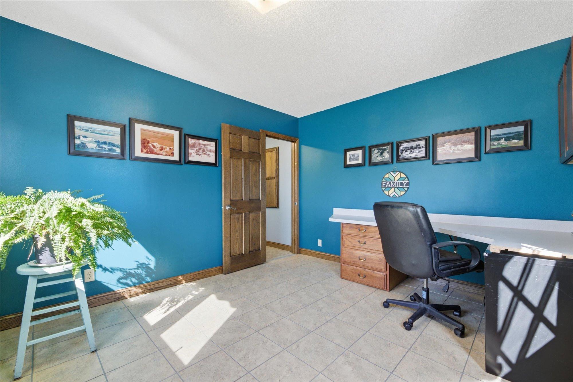 Main floor office. Desk is not built in, opportunity for other possibilities: exercise room, play room, sewing room or?