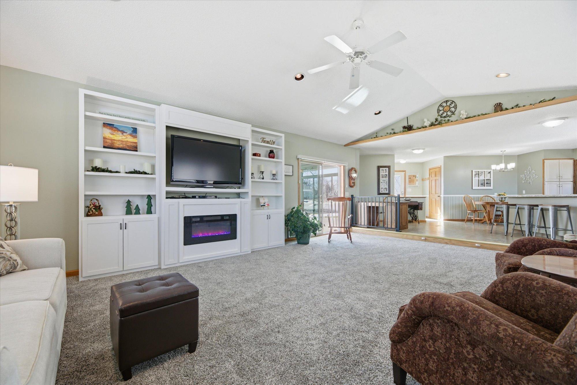Living Room features vaulted ceilings and recessed ceiling lights. Wall unit is negotiable.