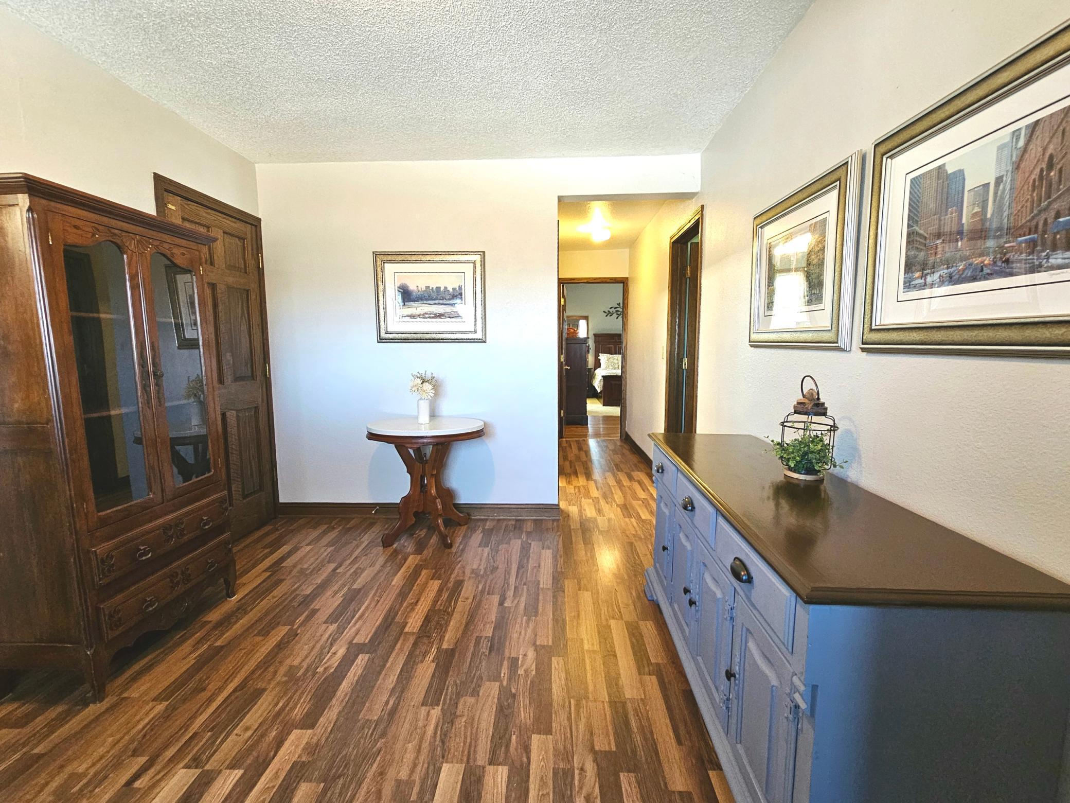 Main floor den opens to hall.