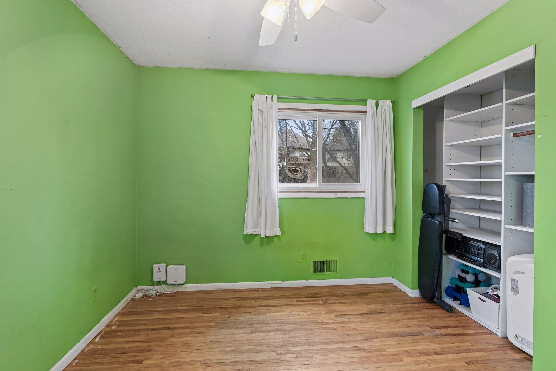 The second bedroom on the main level is bright and cheery